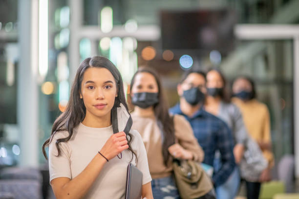 istock Normalize Wearing A Mask On Campus Stock Photo 1304998660