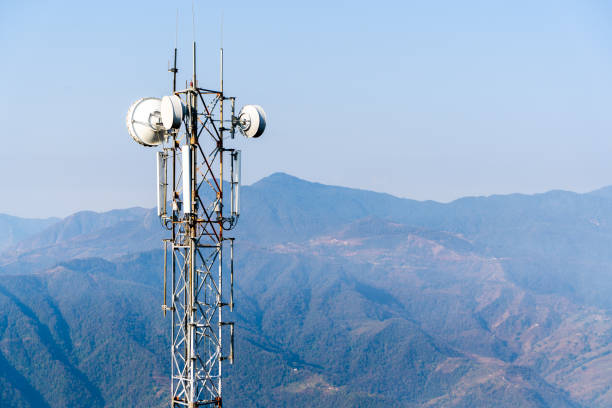 istock Telecommunication tower with antennas. Wireless Communication Antenna Transmitter with Mountains on Background. Stock Photo. 1304999332