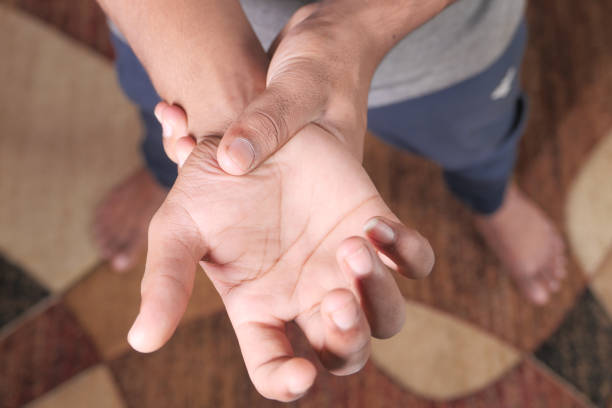 istock man suffering pain in hand close up 1305005009