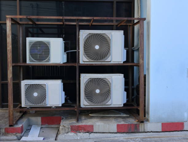 stack of condensing units on metal frame - sign rusty industry no parking sign imagens e fotografias de stock