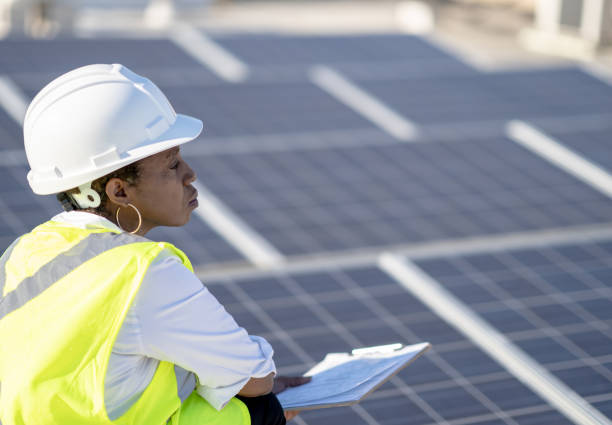 istock Female Engineer Working With Solar Panels Stock Photo 1305011720