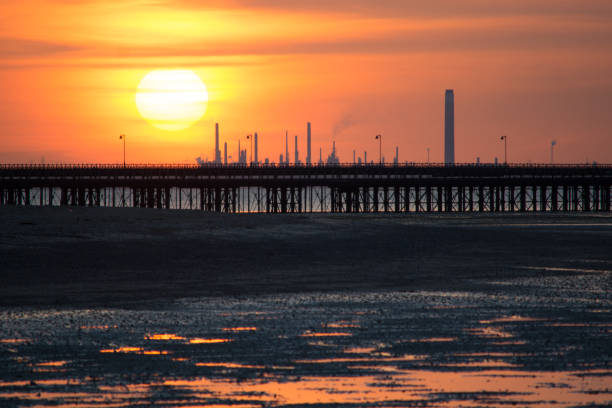 istock Beach, Pier and Power Station at Sunset 1305012363