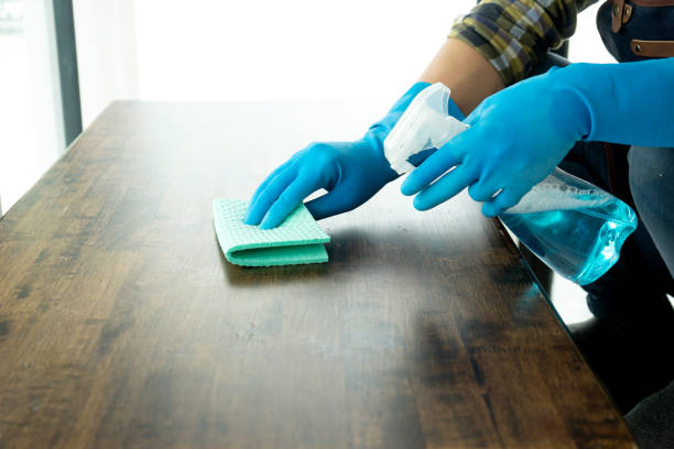 istock Staff are cleaning the table top using cloth and disinfectant for clean 1305012453
