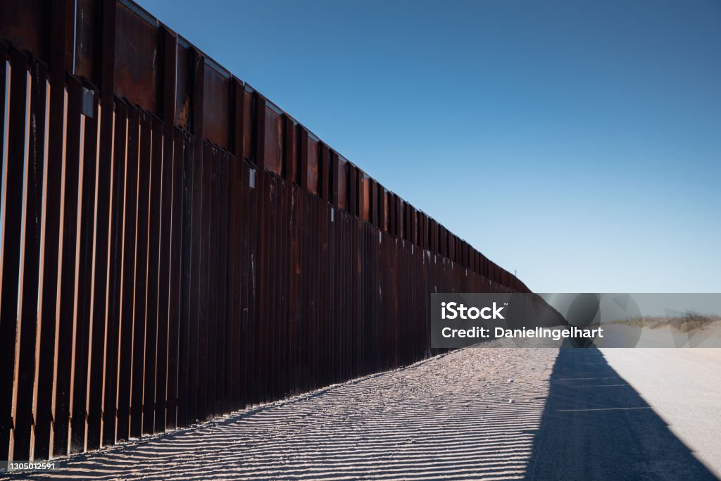 Border Wall At the El Paso US, Mexican border wall that separates El Paso, Texas and Juarez International Border Barrier Stock Photo