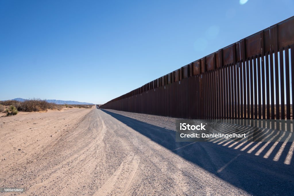 Border Wall At the El Paso US, Mexican border wall that separates El Paso, Texas and Juarez International Border Barrier Stock Photo