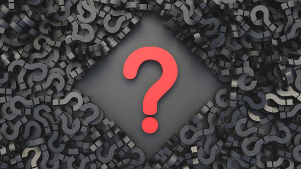istock Big red question mark on a background of black signs, top view, FAQ Concept 1305015687