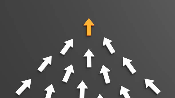 istock Leadership concept, orange leader arrow leading white arrows, on black background 1305015698