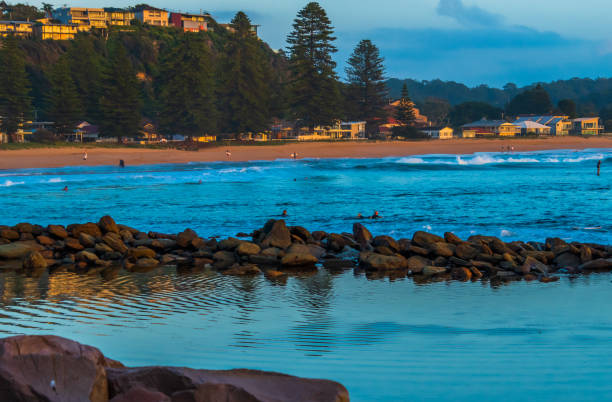 Early mornings at the seaside Starting the day at the beach in Avoca Beach on the Central Coast, NSW, Australia. avoca beach photos stock pictures, royalty-free photos & images