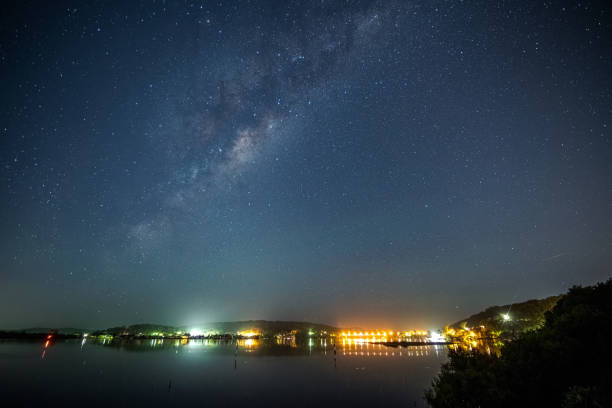 istock Stars and milky way waterscape 1305019330