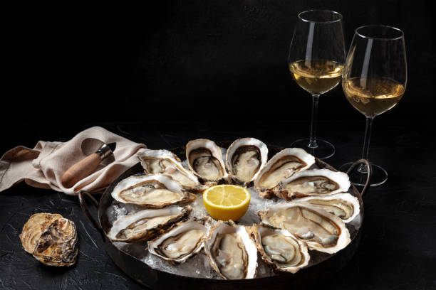 Oyster dozen with white wine and lemon