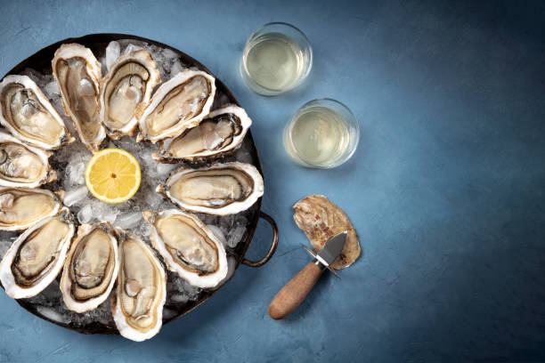 istock Oysters with wine, an overhead flat lay shot with a place for text 1305020287