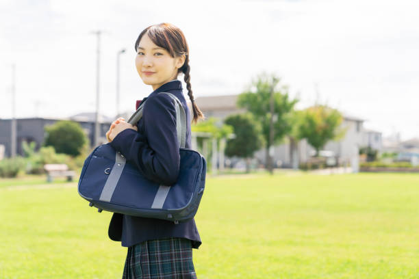 istock Asian female high school student commuting to school. 1305021385