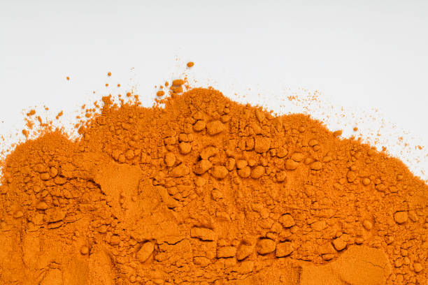 istock yellow curcuma or turmeric powder on white background. top view. copy space. spice and medicinal herb concept 1305023123