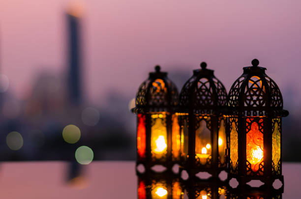 istock Ramadan Kareem lanterns with city light background. 1305026505