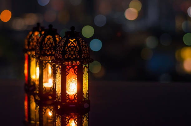 istock Ramadan Kareem lanterns with city light background. 1305026544