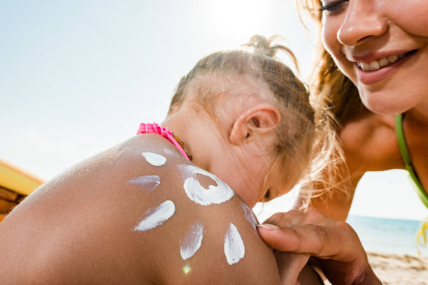 istock Mommy will put you some suntan lotion! 1305032120
