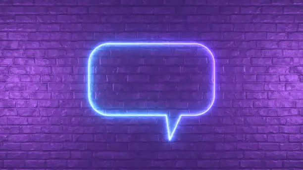 Photo of Neon Lighting Glowing Speech Bubble on Black Brick Wall