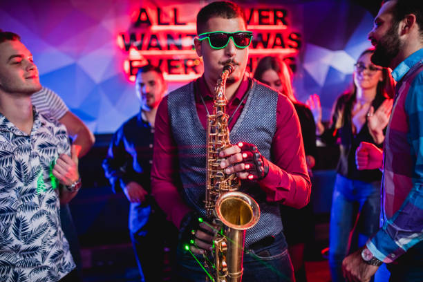 istock Saxophonist on club party 1305036210