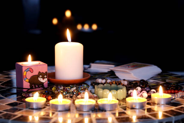 istock Fortune telling session, candles are burning on the round table 1305037648