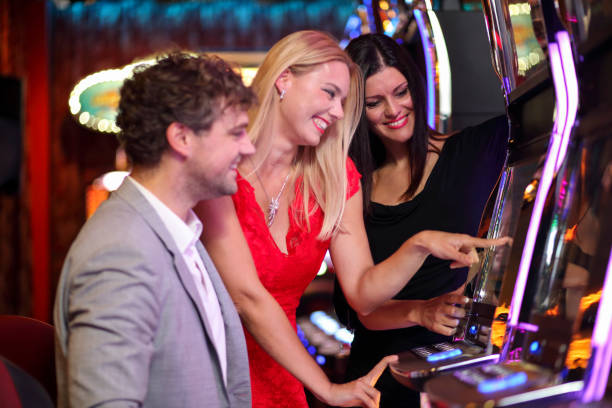 istock Friends on slot machine having fun 1305041580