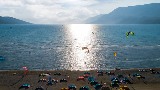 istock Kitesurfing on the beach during summer vacation 1305044498