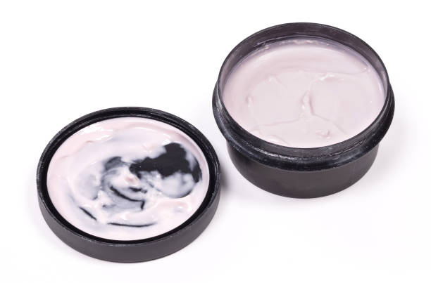 istock Creamy pink lotion isolated on a white background 1305045907