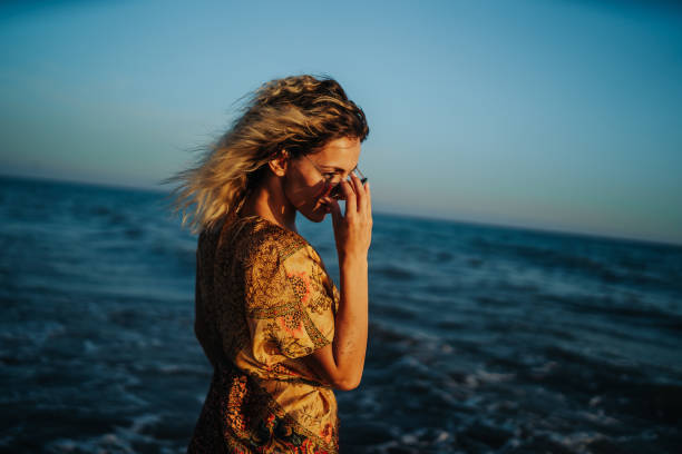 istock Beautiful woman on the beach 1305046153