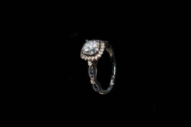 istock Diamond Ring, Gold ring with natural diamonds on a dark background 1305047026