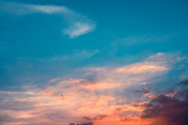istock Sunbeams breaking through the clouds with blue and orange sky. Hope, prayer concept for background. 1305048734