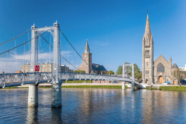 Inverness city with bridge over Ness river in Scotland, United Kingdom of Great Britain and Northern Ireland Inverness city with bridge over Ness river in Scotland, United Kingdom of Great Britain and Northern Ireland bridge crossing cloud built structure stock pictures, royalty-free photos & images