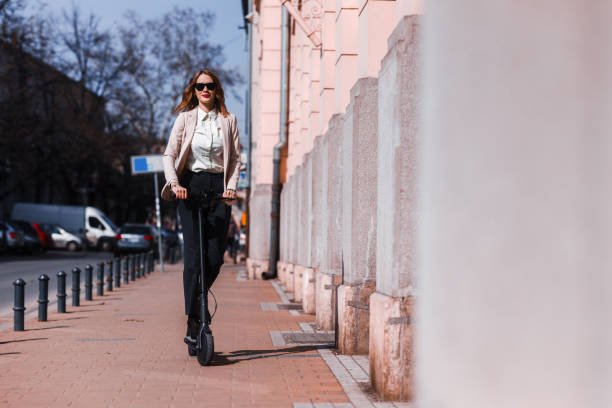 istock A young woman with electric scooter 1305052359