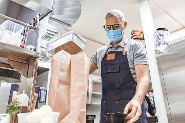 istock Food delivering in pandemic situation 1305053575