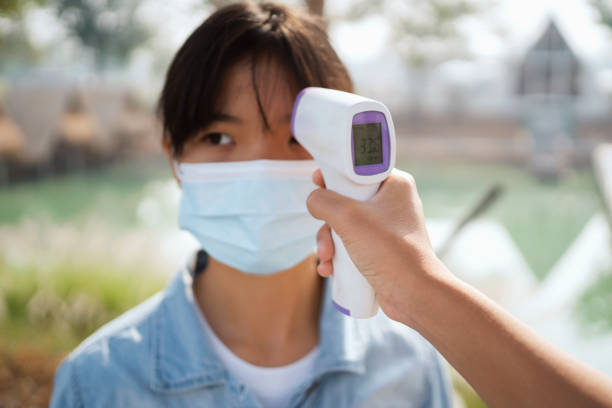 istock Taking temperature with thermometer to find infected by coronavirus Covid-19 1305054841