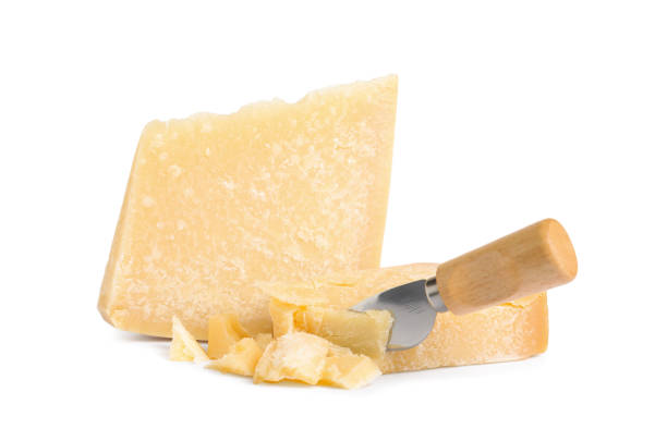 istock Delicious parmesan cheese and knife on white background 1305059754