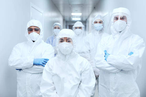 istock Doctors in protective uniforms at hospital 1305061092
