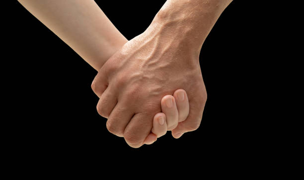 istock invisible Caucasian people hold hands tightly. 1305061233
