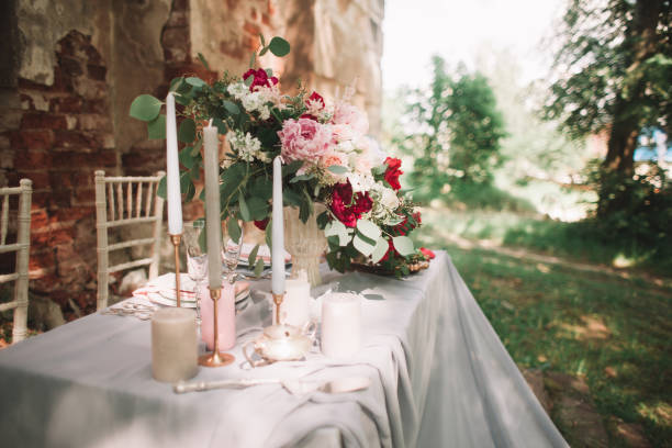 beautiful wedding table with candles in the garden. holidays and events