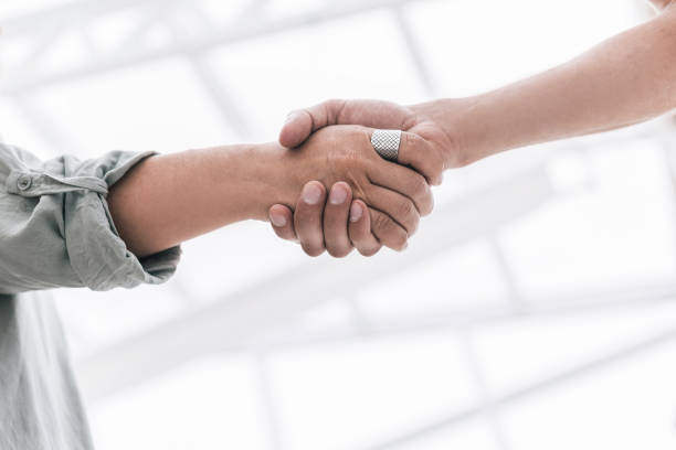 istock close up. handshake business partners on blurred office background 1305065280