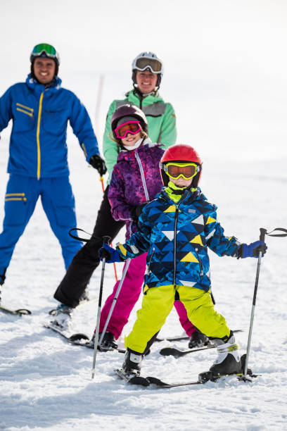 istock Boy and his family on ski vacation 1305066377