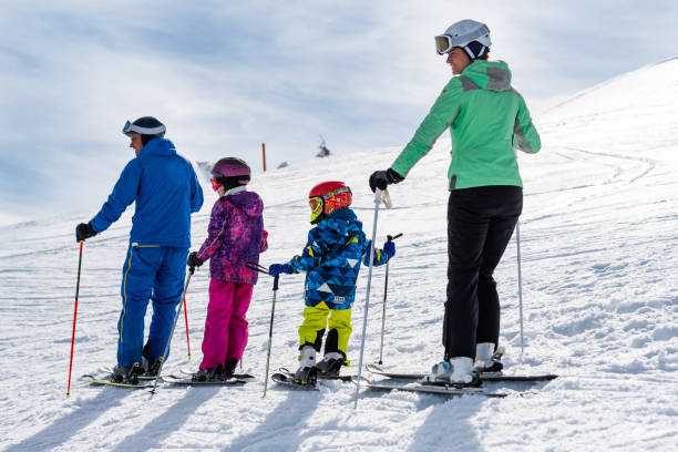 istock Ski family looking down to mountain 1305066521