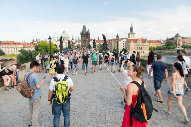 People on Charles bridge over Vltava river, Prague, Czech Republic