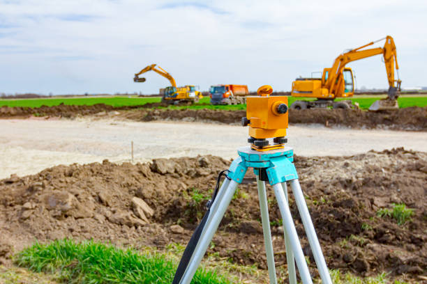 istock Geodesist device on tripod on a building site 1305068853