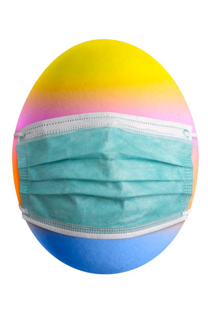 istock Large picture of an easter egg with rainbow colors and mask. 1305074628