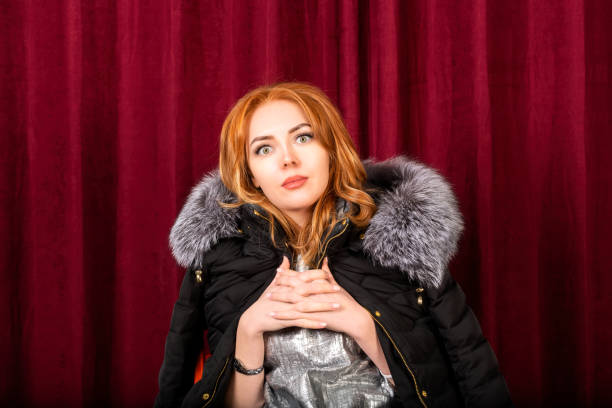 Redhead woman is acting on theater stage