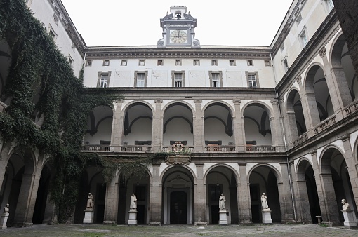 Naples, Campania, Italy - February 26, 2021: Chiostro del Salvatore, or Courtyard of the Statues, of the monumental complex of Gesù Vecchio in Via Palladino which houses several departments of the Federico II University
