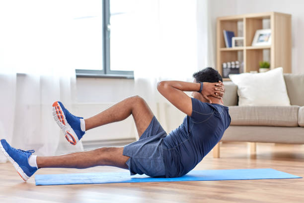 istock indian man making abdominal exercises at home 1305077736