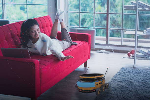 Futuristic automatic robot concept facilitates and creates relaxation in smart home,security,home care,health check medical online with artificial intelligence or AI,woman connecting robots by voice
