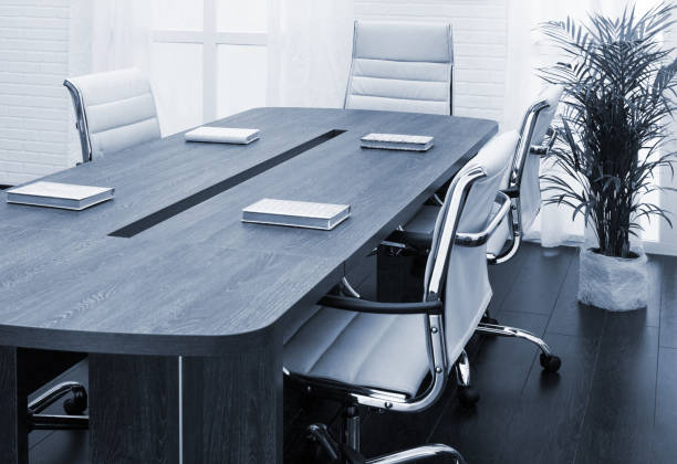 istock large table and chairs in a modern conference room 1305079997