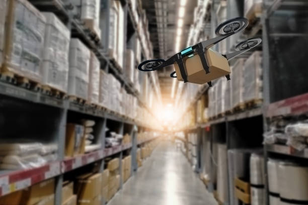 istock Concept industry 4.0 robotic drone artificial Intelligence,autonomous Robot of warehouse logistic,smart automated delivery vehicle,modern storehouse shipping,with robot carrier carrying cardboard box 1305080026