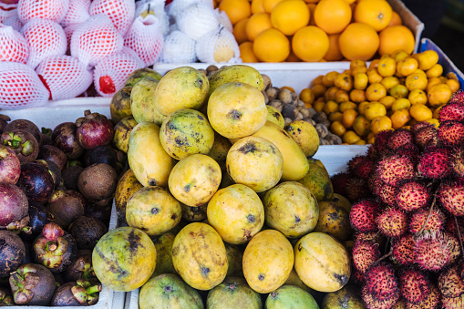 tropical fruits at the market on a street